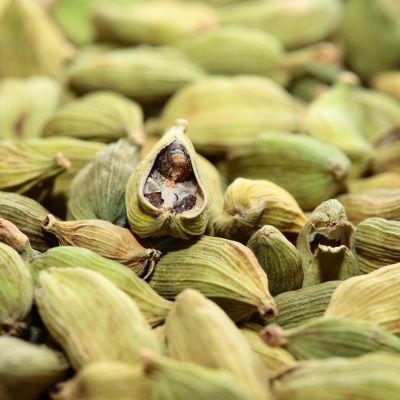 Green cardamom seeds. Aromatic spice.texture background